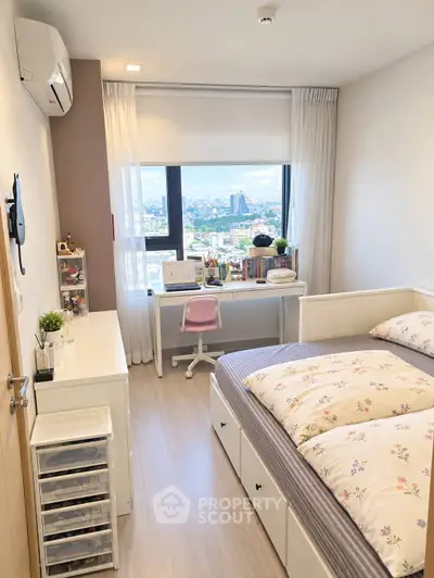 Bright bedroom with city view, featuring a cozy bed, study desk, and ample storage, perfect for urban living.
