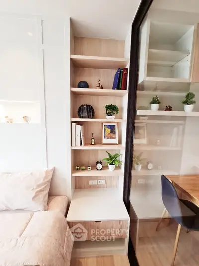 Modern living room with stylish shelving and cozy workspace