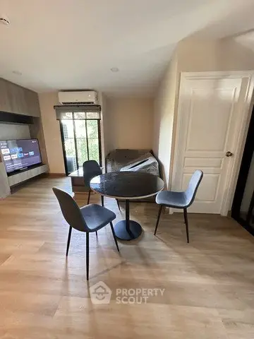 Modern living room with stylish dining area and large window view