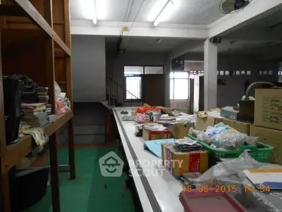 Spacious storage area with shelves and boxes, ideal for organizing and storing items efficiently.