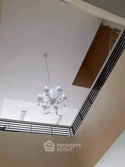 Elegant interior ceiling view with modern chandelier in a stylish home