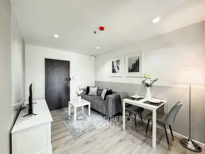 Modern living room with stylish decor and cozy seating area, perfect for relaxation and entertainment.