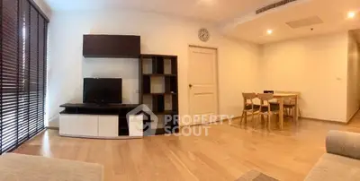 Spacious modern living room with wooden flooring and stylish furniture