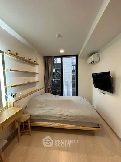 Cozy modern bedroom with large window and minimalist decor