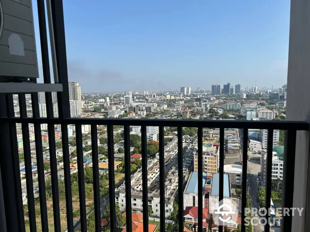 Stunning cityscape view from high-rise balcony, perfect for urban living enthusiasts.