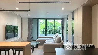 Modern living room with large windows and balcony view