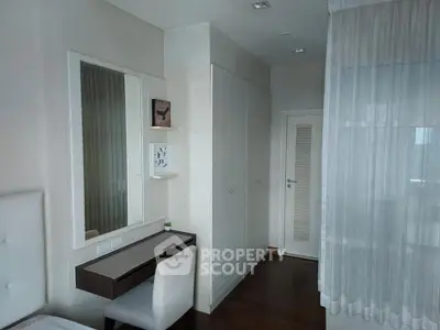 Elegant bedroom with modern furniture and ample storage space