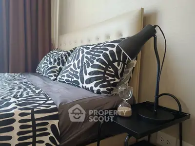 Stylish bedroom with modern decor and elegant bedside lamp