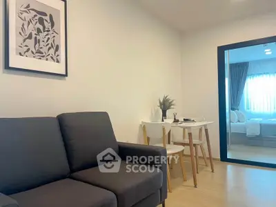 Modern living room with cozy sofa and dining area in stylish apartment