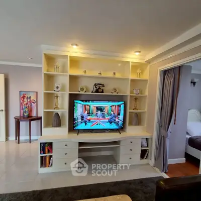 Spacious living room with built-in entertainment center and modern decor