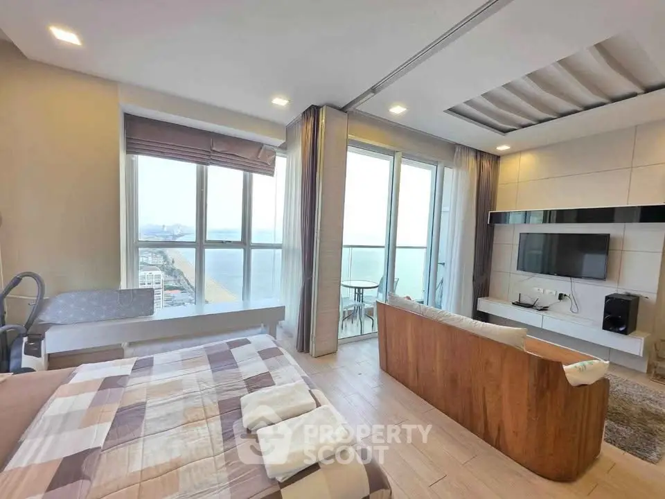 Luxurious beachfront apartment with stunning ocean view and modern living room design.