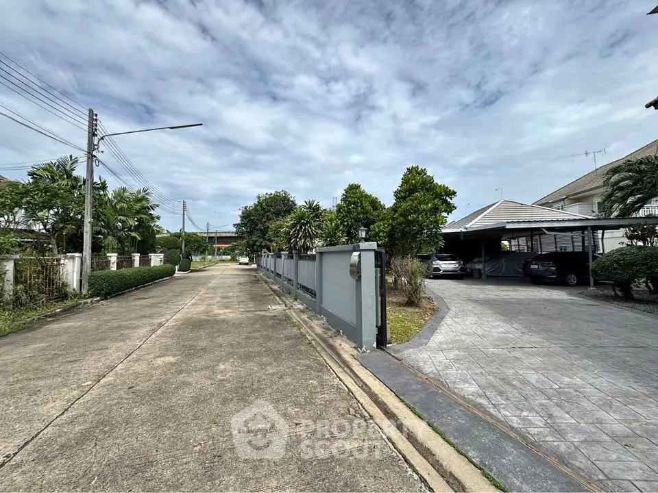 Charming suburban street with modern houses and lush greenery, perfect for family living.