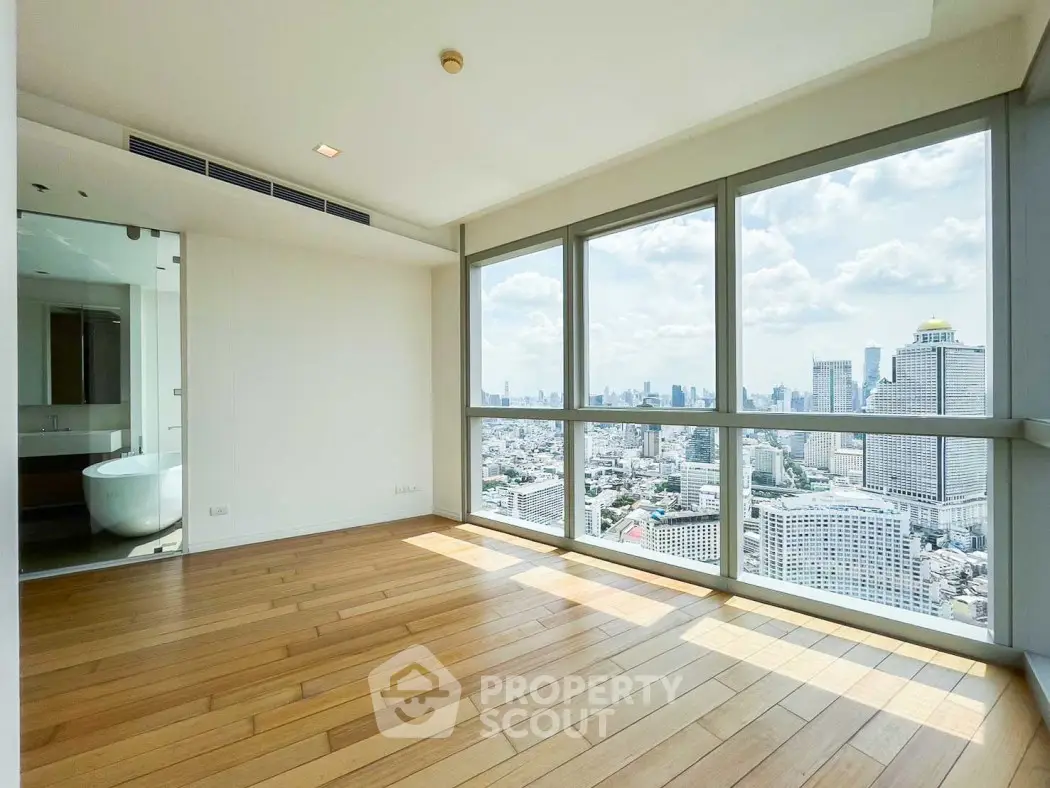 Spacious corner unit with panoramic city views and elegant hardwood floors