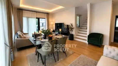 Luxurious open-plan living and dining area with elegant decor and modern furnishings.