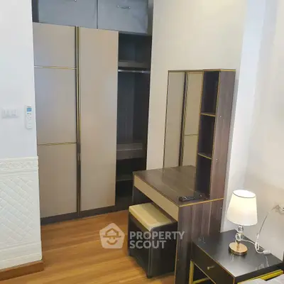 Modern bedroom with stylish wardrobe and dressing table, perfect for urban living.