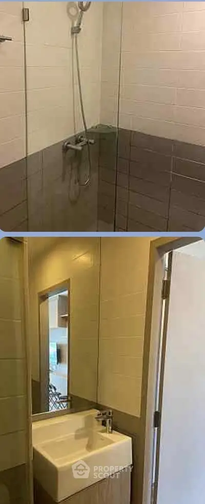 Modern bathroom with sleek shower and stylish sink in a contemporary apartment.