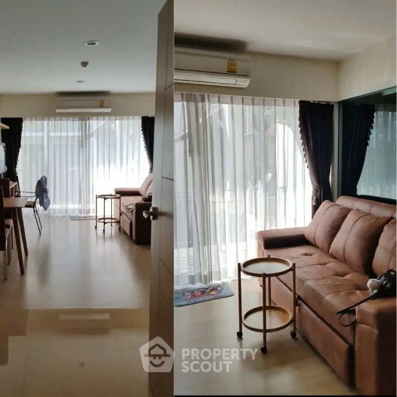 Spacious living room with modern furniture and large windows for natural light.