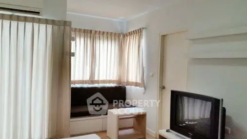 Cozy living room with natural light and modern furnishings