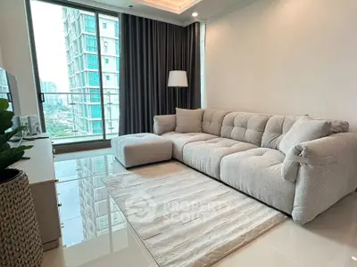 Modern living room with plush sofa and city view from large window