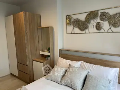 Modern bedroom with stylish wooden furniture and elegant wall art