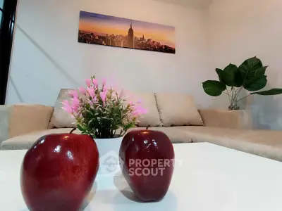 Stylish living room with modern decor and vibrant artwork, perfect for relaxation and entertaining.
