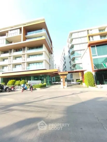 Modern apartment complex with spacious balconies and contemporary design.