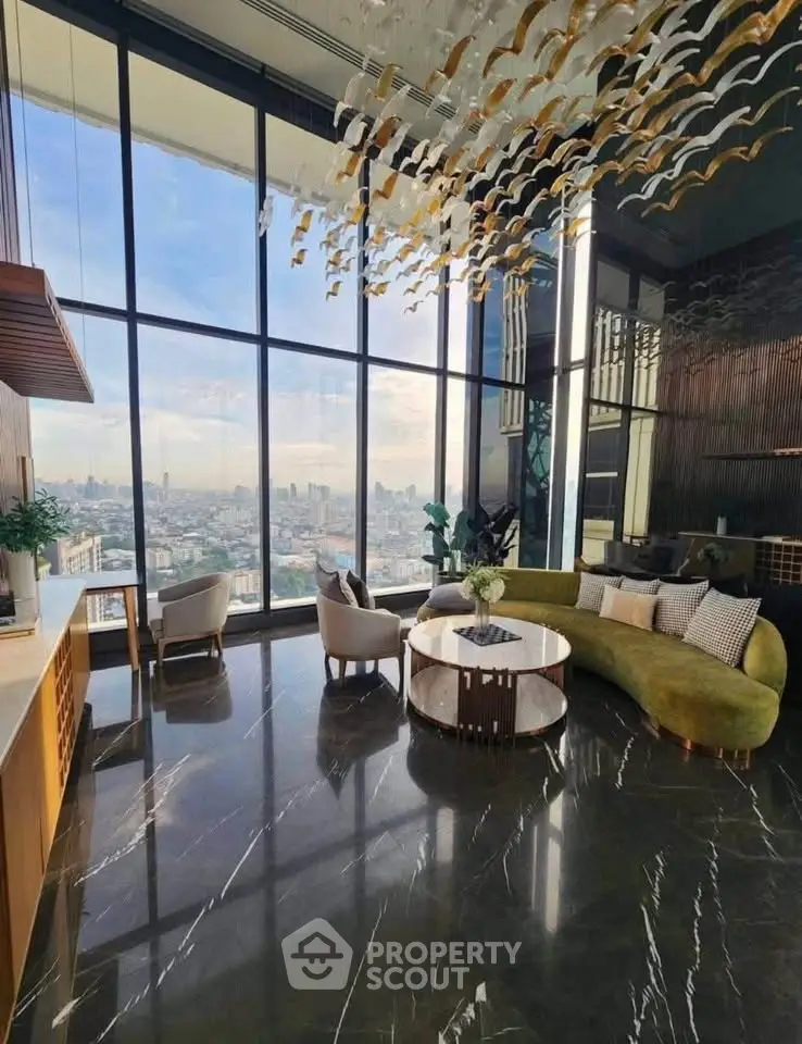 Luxurious high-rise living room with floor-to-ceiling windows and stunning city views.