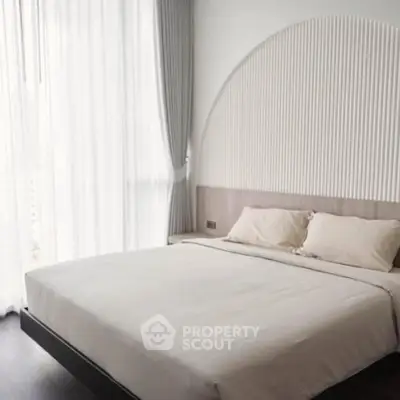 Elegant bedroom with modern design and large window for natural light