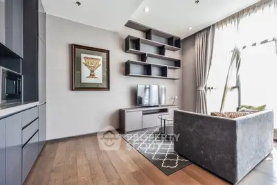 Modern living room with stylish shelving and large window for natural light.