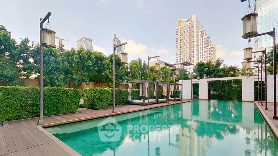 Luxurious rooftop pool with city skyline views and lush greenery in a modern urban setting.