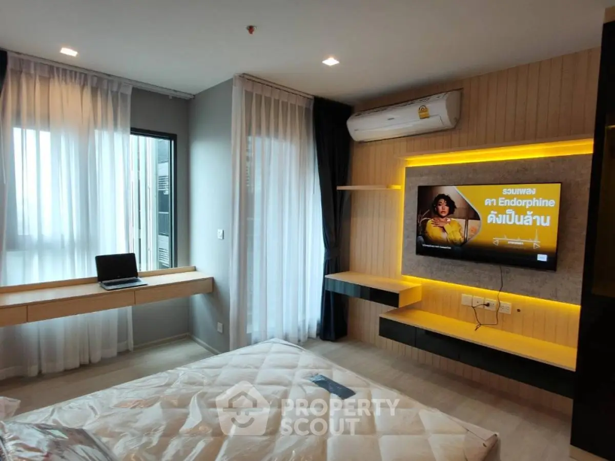 Modern bedroom with stylish built-in shelves and air conditioning