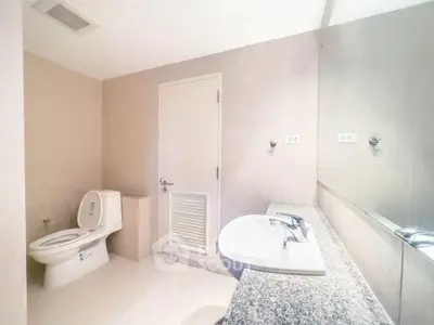 Spacious modern bathroom with sleek fixtures and neutral tones