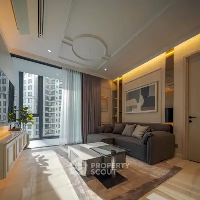 Luxurious modern living room with elegant decor and large windows offering city views.