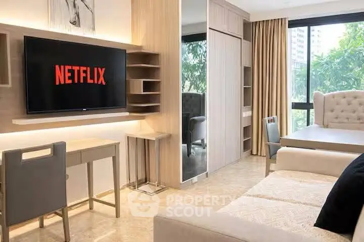 Modern living room with stylish furniture and large window view