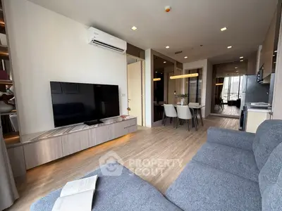 Modern living room with sleek design, open layout, and stylish furniture in a contemporary apartment.