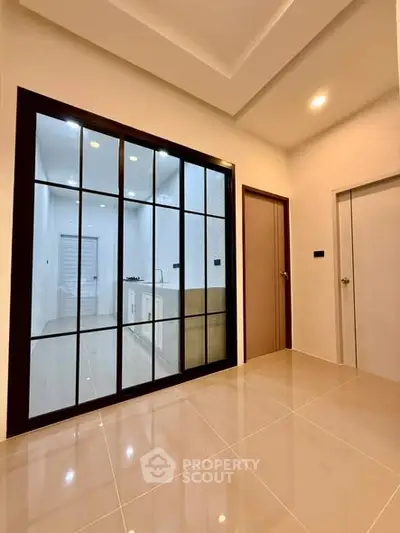 Modern interior with glass partition and sleek flooring