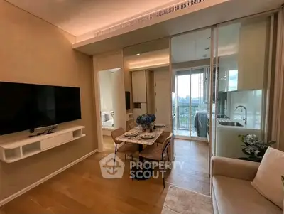 Modern living room with dining area and kitchen, featuring sleek design and city view.