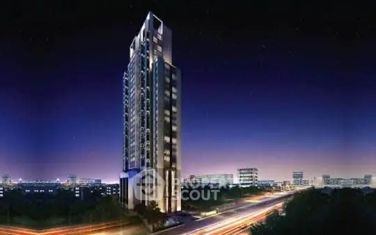 Stunning night view of a modern high-rise building in a vibrant cityscape.