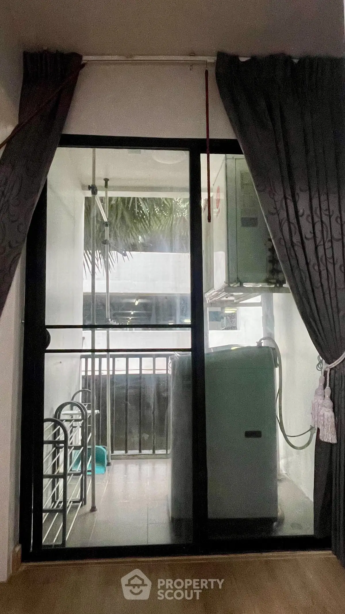 Compact balcony with washing machine and storage space