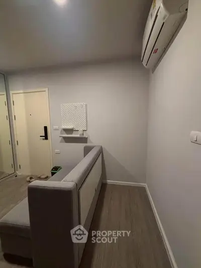 Modern minimalist room with air conditioning and sleek flooring
