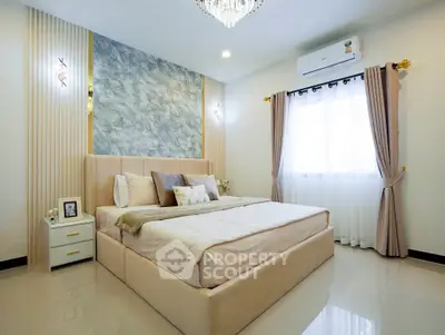 Luxurious bedroom with elegant decor and natural light