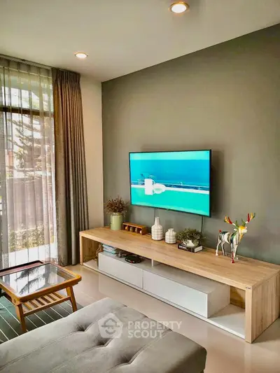 Modern living room with sleek TV setup and stylish decor