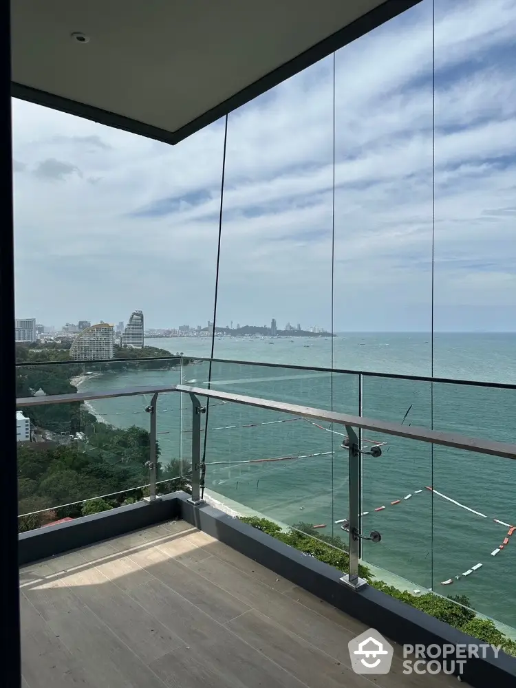 Stunning balcony view overlooking the ocean and city skyline, perfect for relaxation and enjoying sunsets.