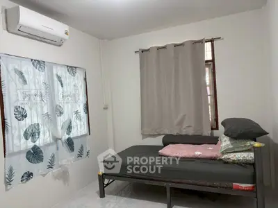 Cozy bedroom with air conditioning and simple decor