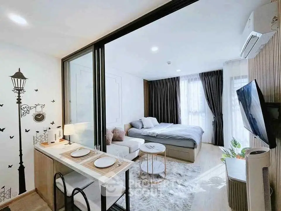 Modern studio apartment with stylish decor, cozy bed, and open living area, perfect for urban living.