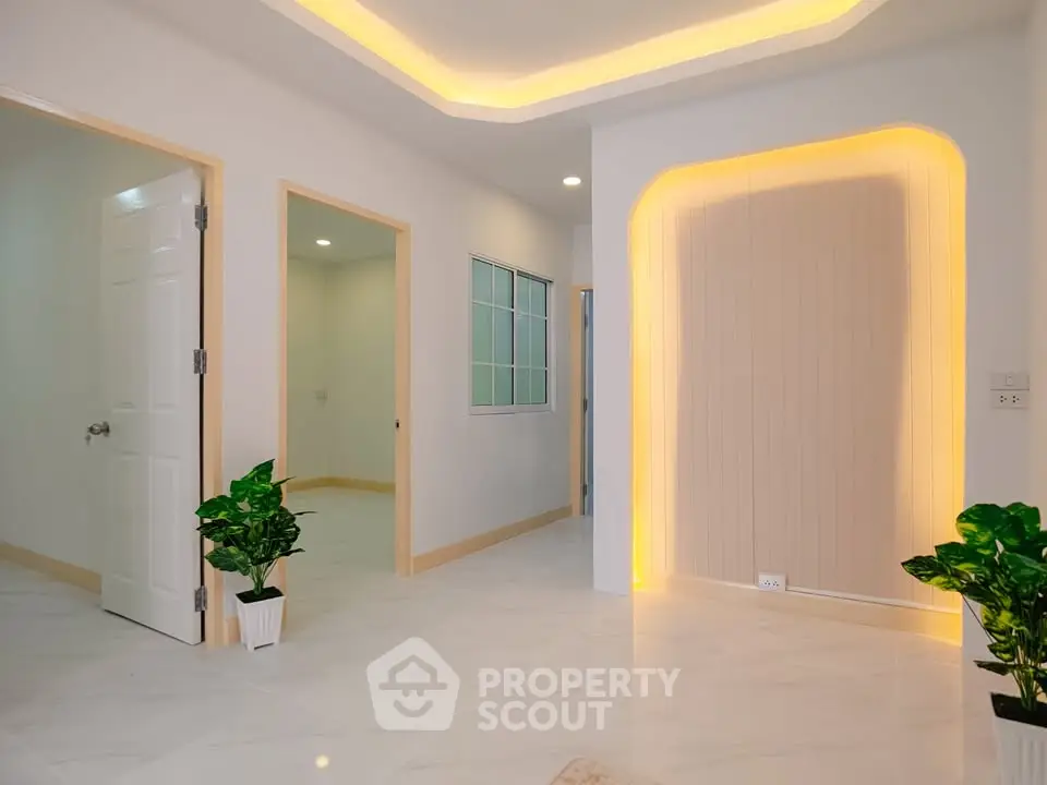 Modern interior with stylish lighting and marble flooring, showcasing a spacious and inviting living area.