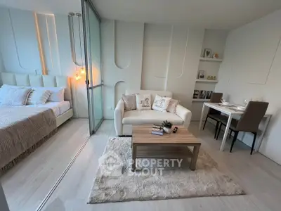 Modern studio apartment with cozy living area and stylish decor