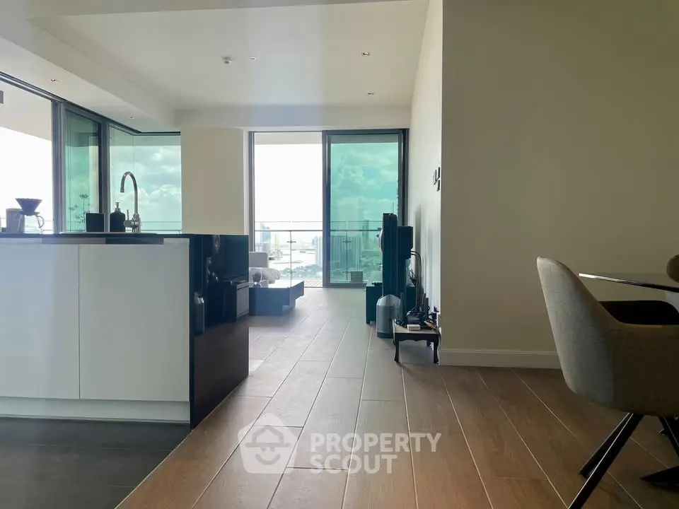 Modern open-plan kitchen and living area with stunning balcony view