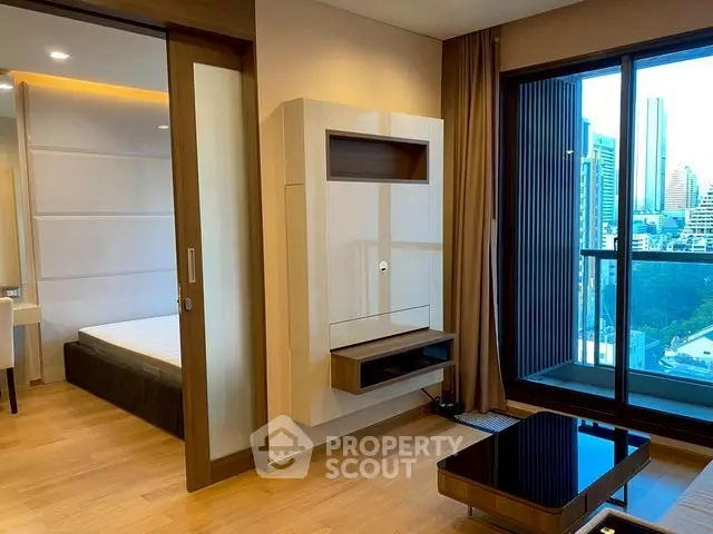 Modern apartment with city view, featuring sleek interior design and spacious layout.