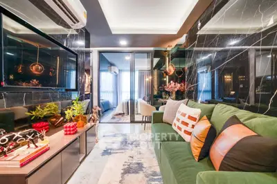 Luxurious modern living room with stylish decor and open view to bedroom